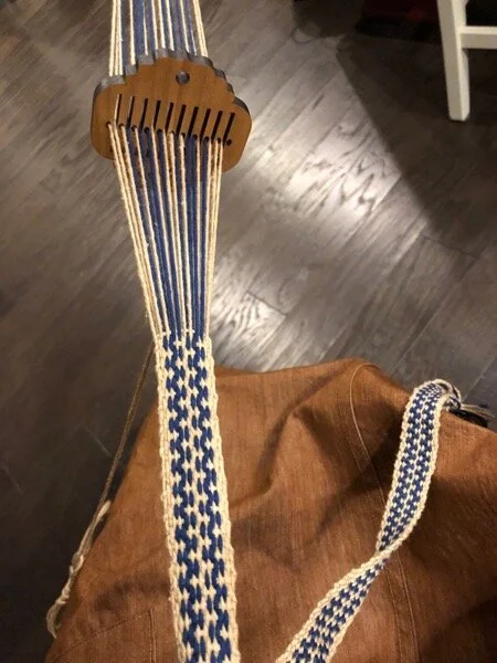 Double zig-zag band in progress, with small wooden rigid heddle, draped over my lap - and I’m wearing my new rust denim jumper, recently designed and sewn by me.
