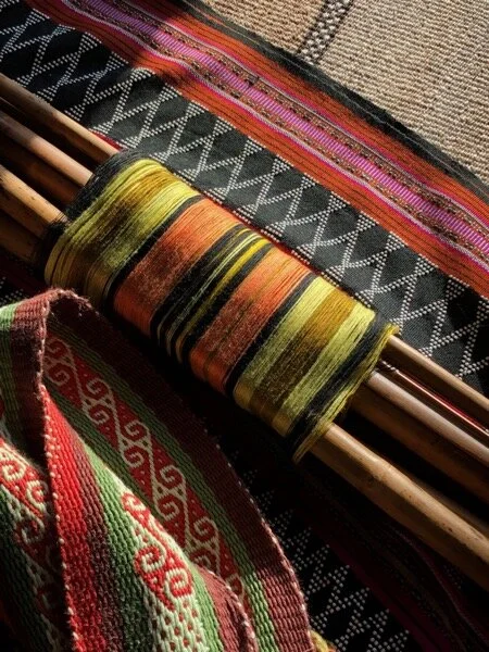Rolled up backstrap weaving, with handwoven backstrap, on top of a Katu beaded weaving, on top of a Bedouin rug from Syria. More on this weaving  here .