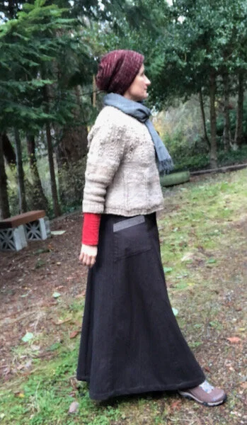 The skirt after sewing was finished, prior to adding woven binding. This is my winter uniform: handspun sweater, long-sleeved shirt, scarf, handknit hat, wool skirt, boots (leggings underneath.) I can put together an outfit made by me except for leggings, underpants and boots - but in this case I did not make the shirt or scarf.