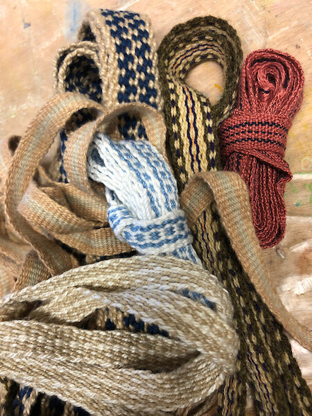 My handwoven tape stash so far: six tapes, mostly cotton, one handspun wool, one handspun silk.