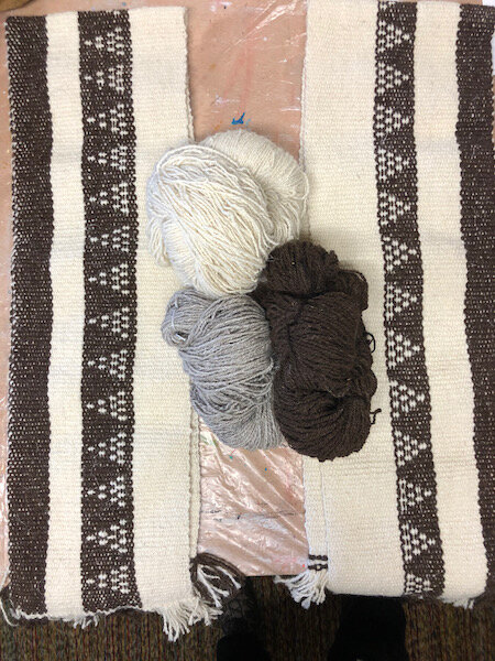Brown and white wool side bands, and the three colors of yarn in the middle. Yeah, I can’t really figure out why the patterned bands are so different in these two, but I’m ignoring it. Symmetry is not my strong suit.