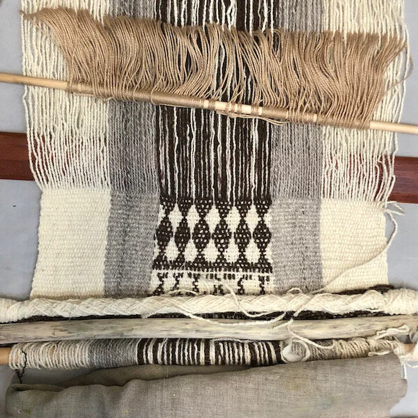 The very beginning - working out some kinks.  A simple repeated hourglass pattern gives me a feel for the numbers and the pickup method, as I try to snug the warps closer together in the pattern section.