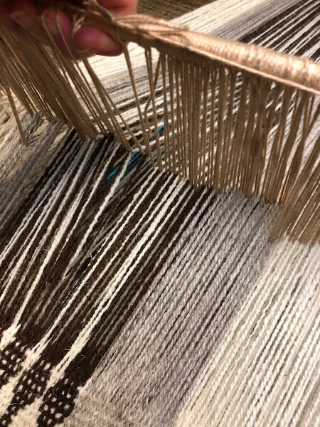 Heddles being raised, shed opening.