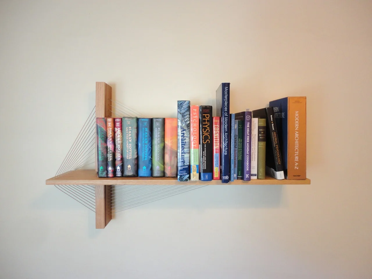 I had to determine how much weight the shelf could support, so what better way than to put all my heavy books on it? It's pictured here with 60 lbs. Didn't seem like weight should be a problem.