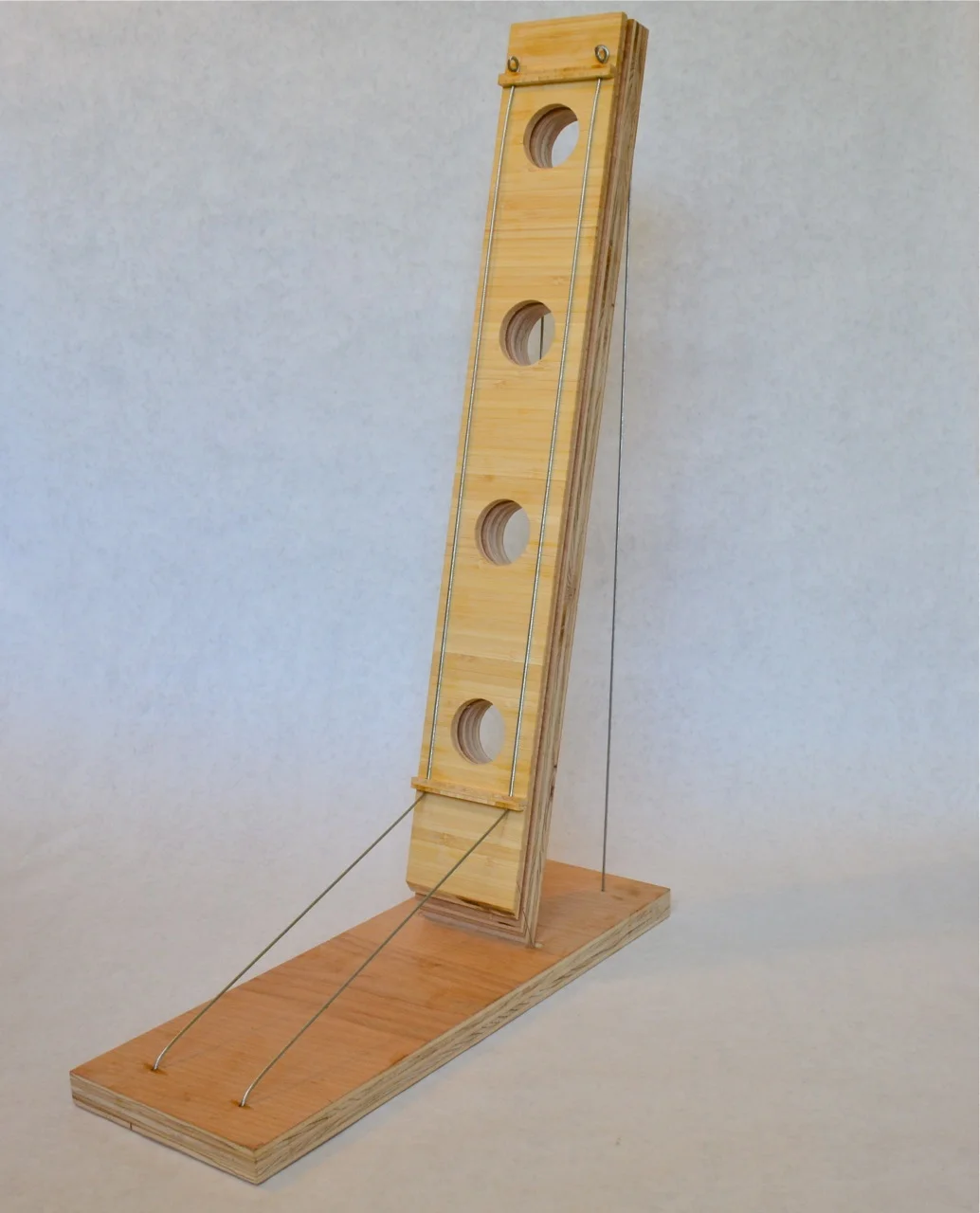 The initial plywood prototype had a wider base than the final version.