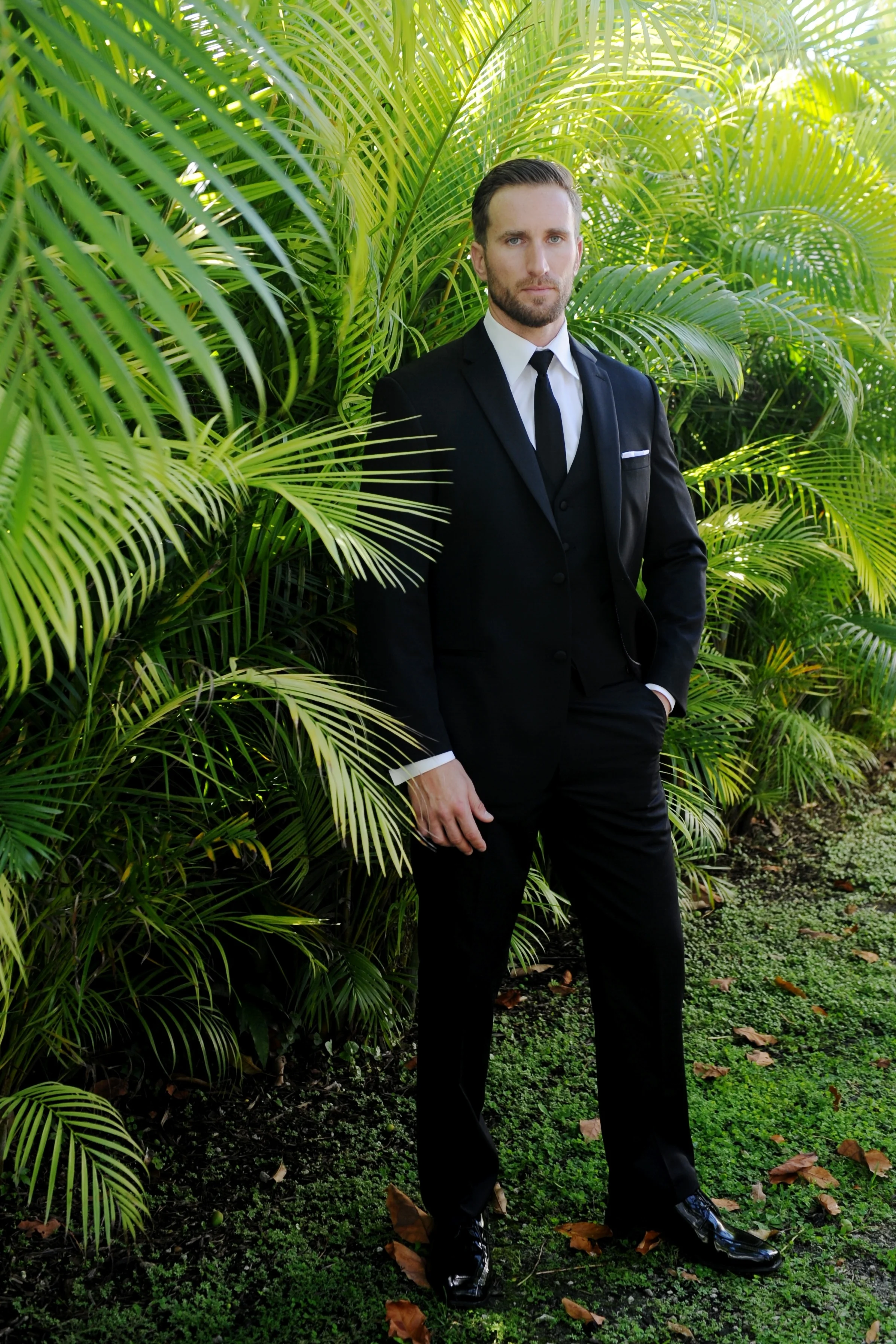 Michael Kors® DESIRE featured above with the full back black vest and a Black Windsor Tie. 