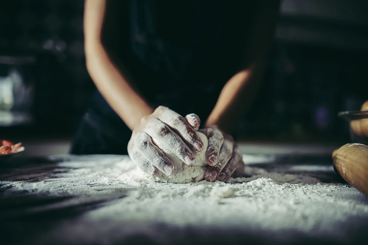 hands kneading dough