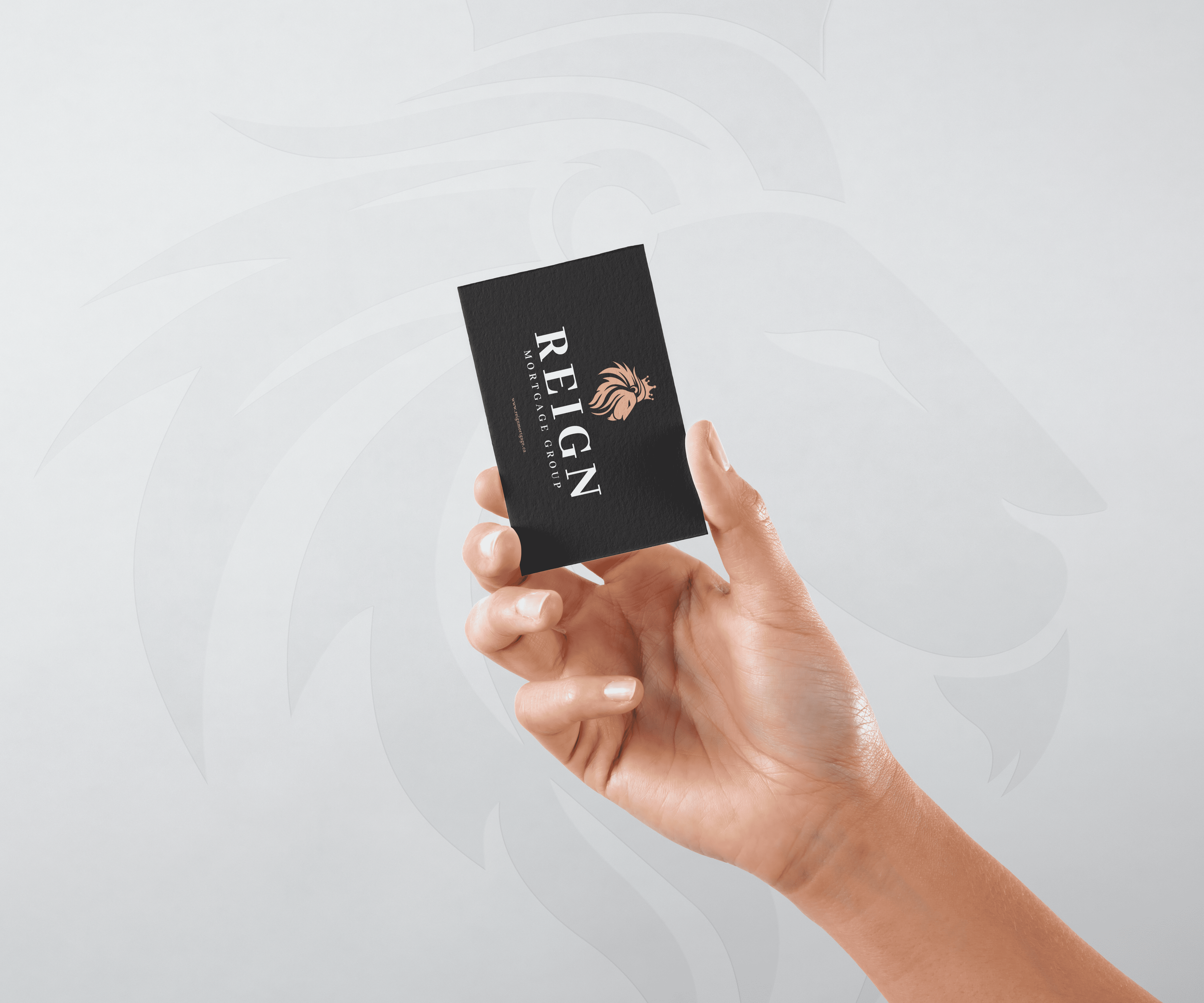Reign Mortgage Group - Business Card + Hand Mockup.png