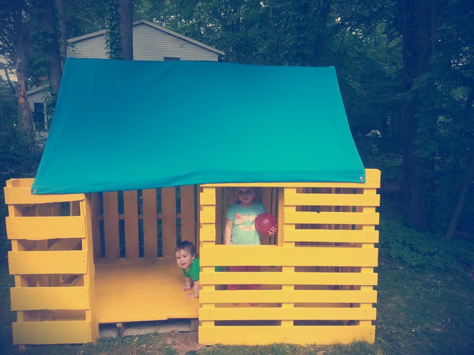 Claire and Noah, enjoying the new pallet playhouse.