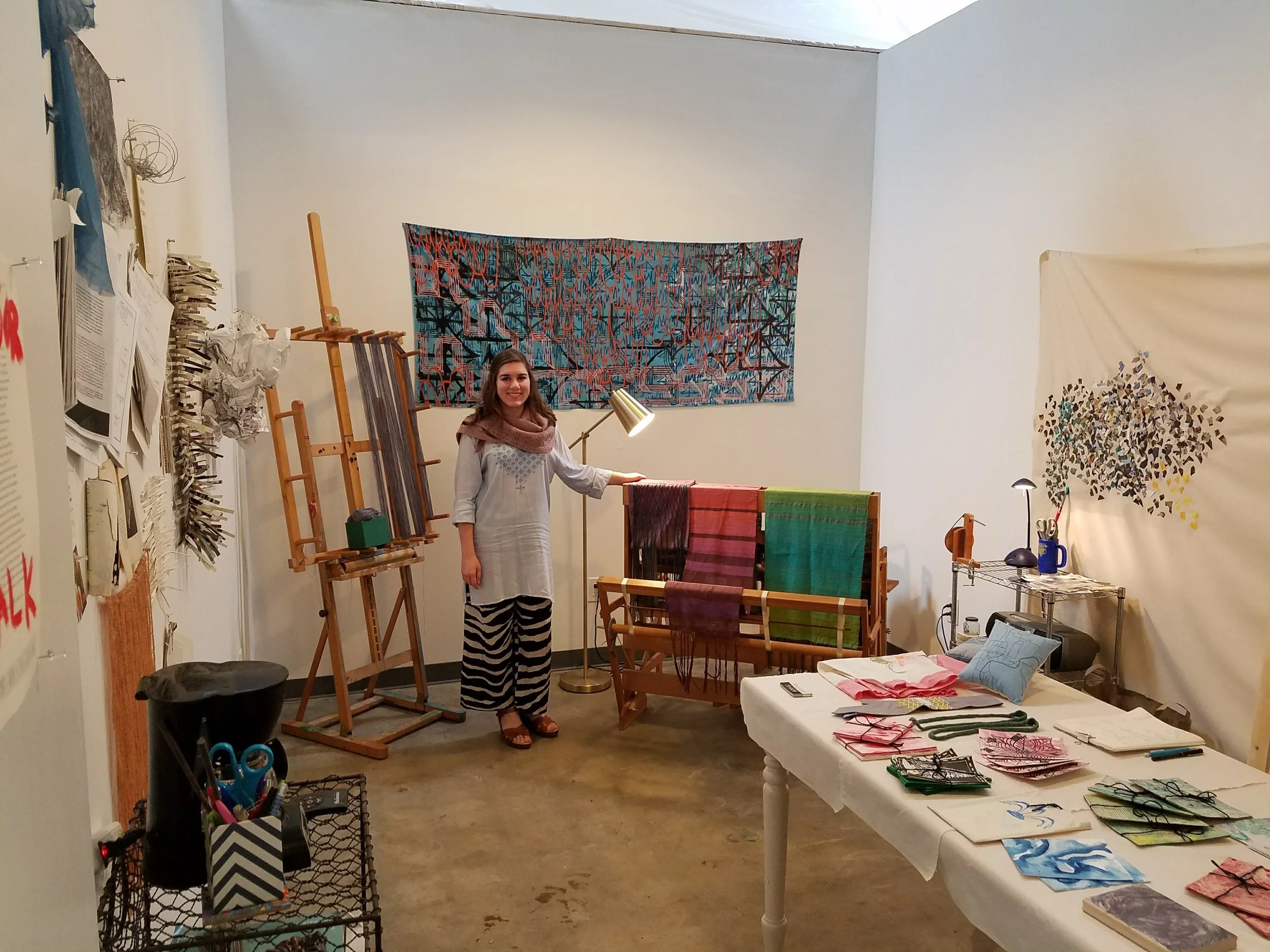 This is me in my studio, ready for the Open Studios event at Hawthorne Arts Complex earlier this month. I sold the two scarves on the left side of the loom, and have completed one more since then.