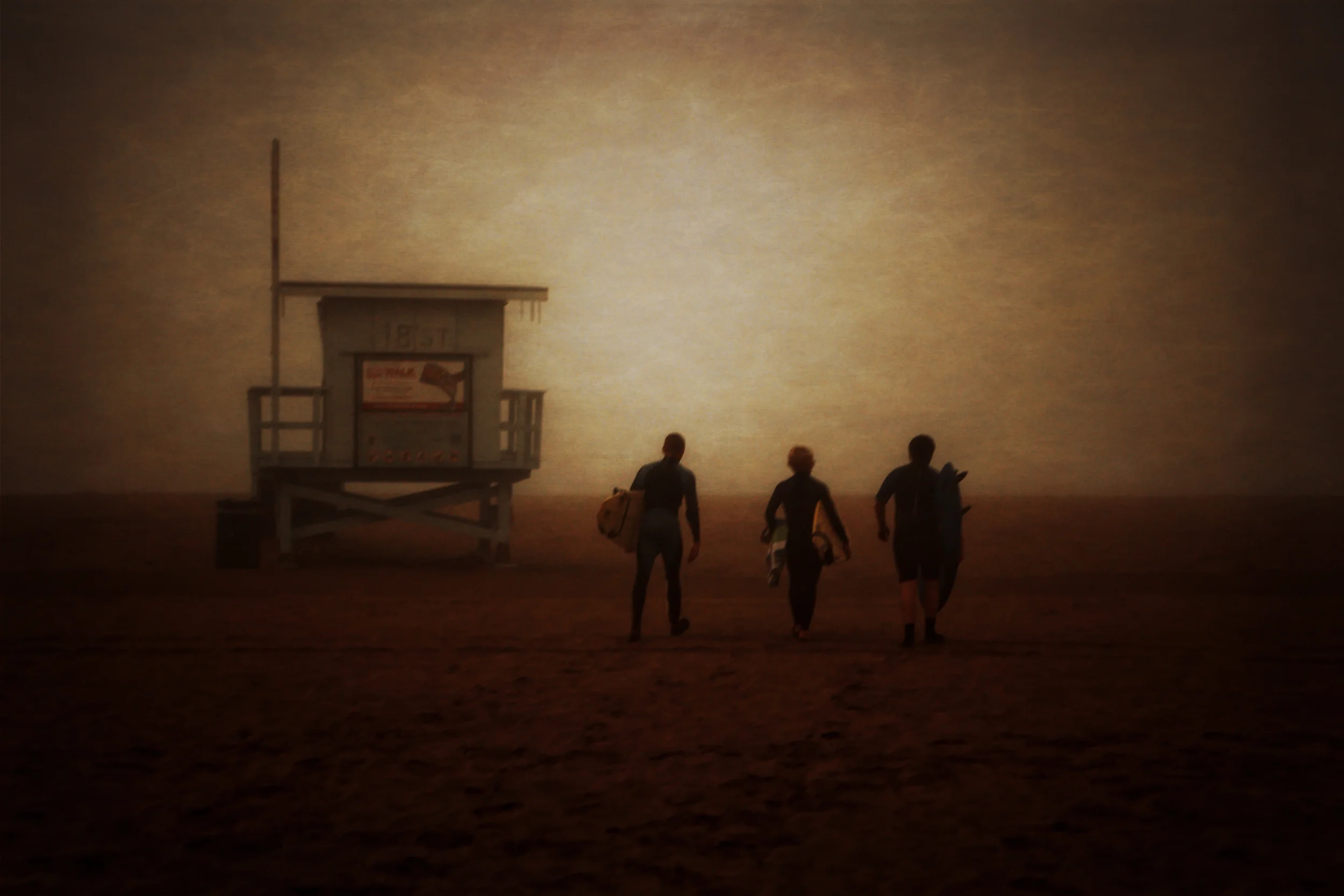 Surfers venture into the fog