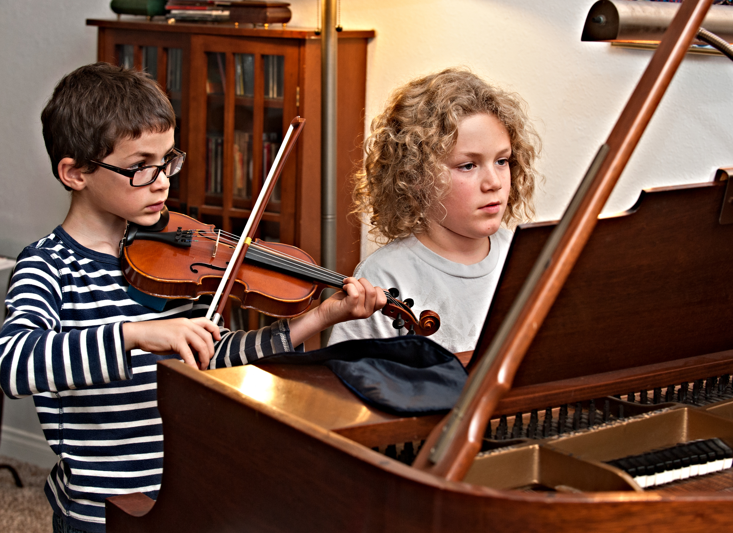 Brothers working on a duet for piano & violin