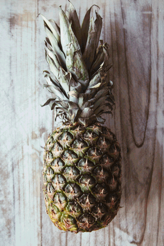 EATME_HOW-TO-CUT-PINEAPPLE_STEP-1.gif