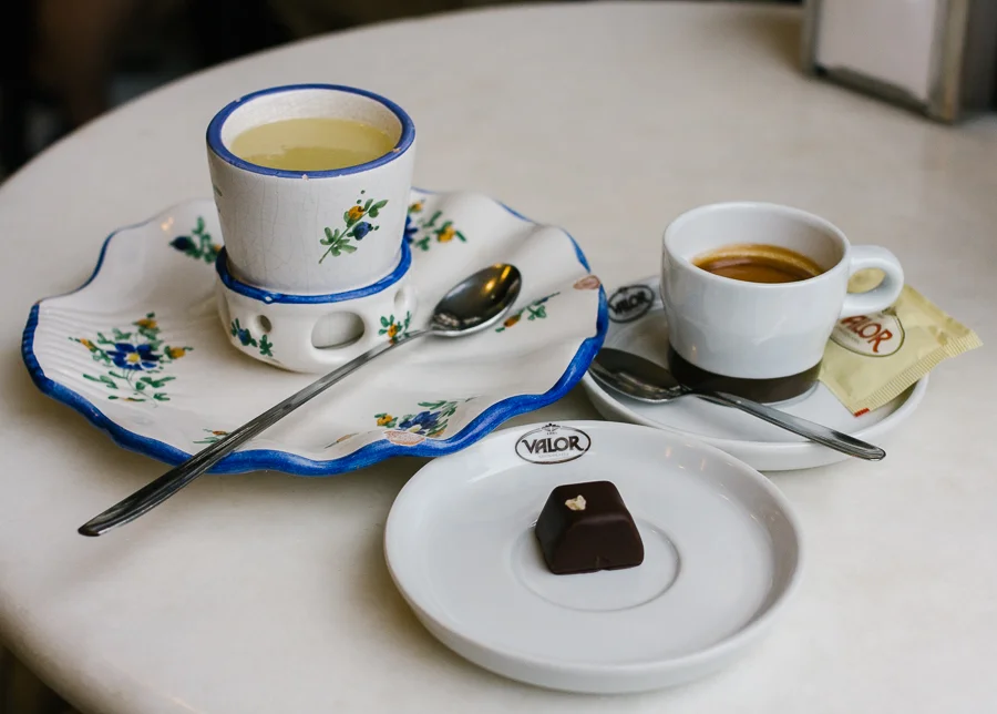 Melted white drinking chocolate, espresso, and little orange choco the server gave me.