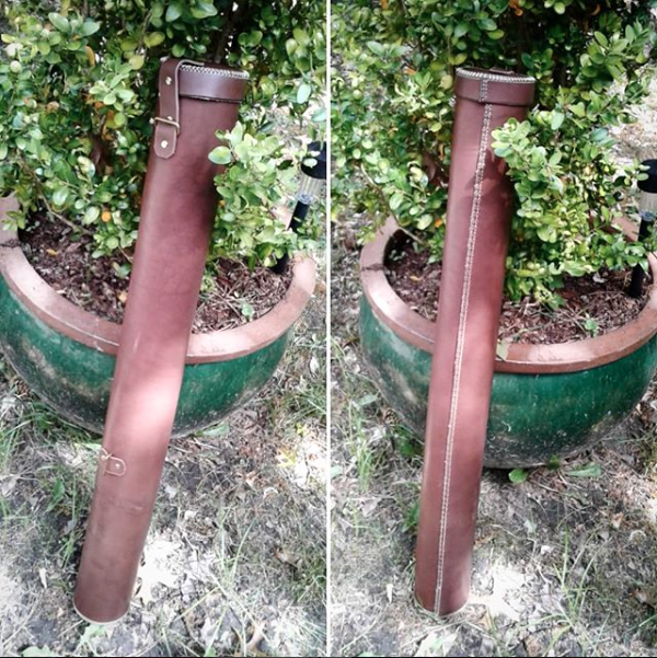 Enclosed quiver (strap not pictured); hand-sewn leather, metal hardware. (2018)