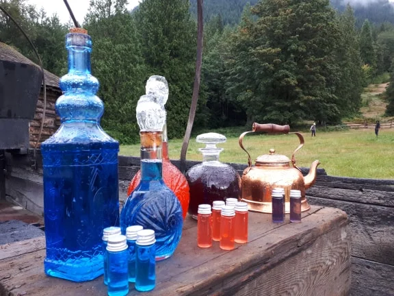 Merchant Table detail, drinkable Mana in vials (Life XP, 2018)