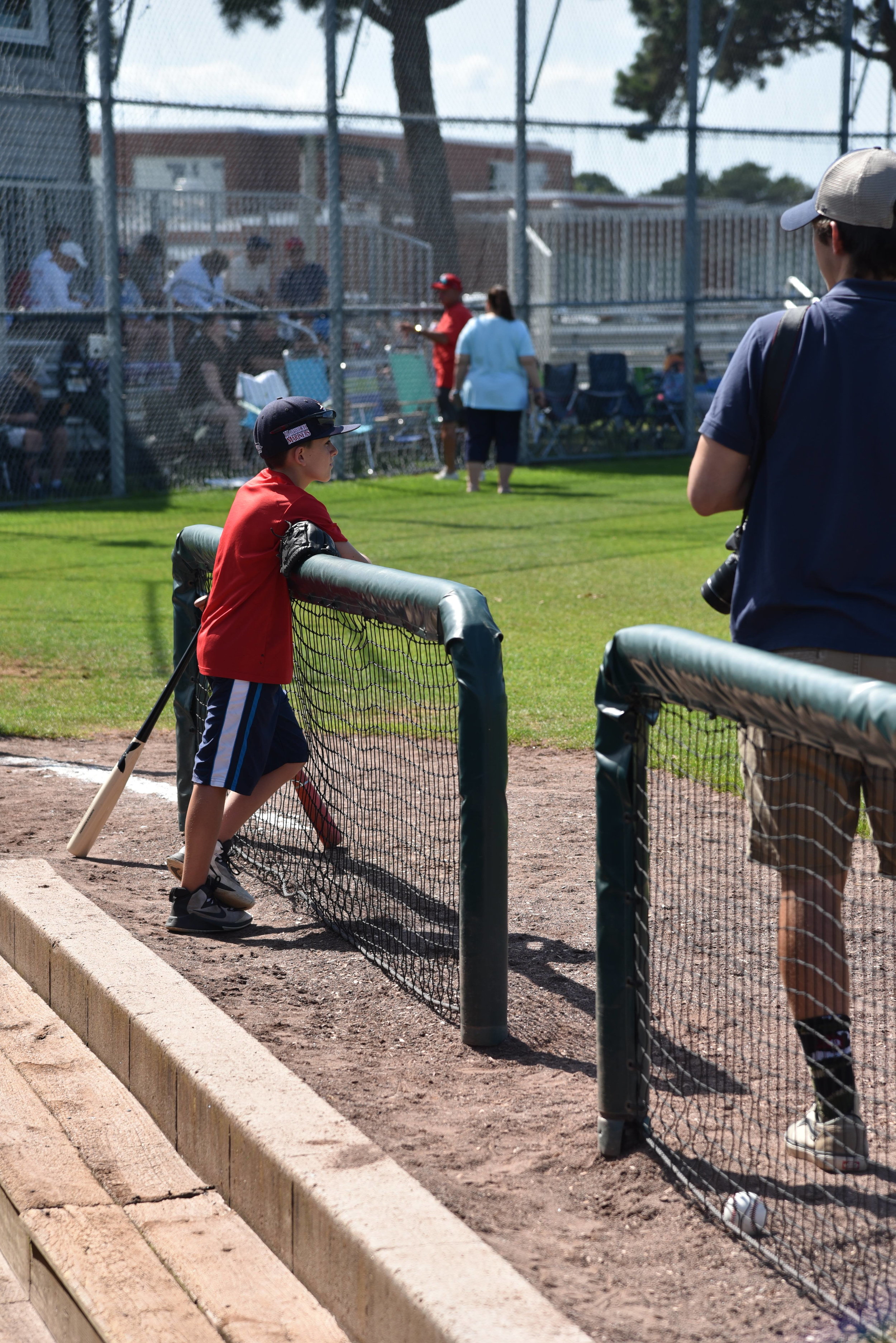 The next generation of Y-D Red Sox player looks on at Red Wilson field before a playoff matchup. Photo by Harrison Meyers