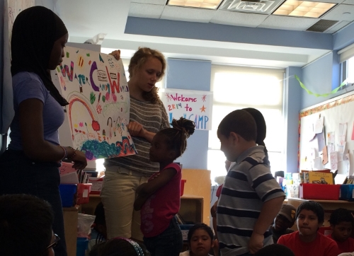 Here's a group of LitCampers at Morning Meeting presenting the flag of a new country they made up - Water Candy World!
