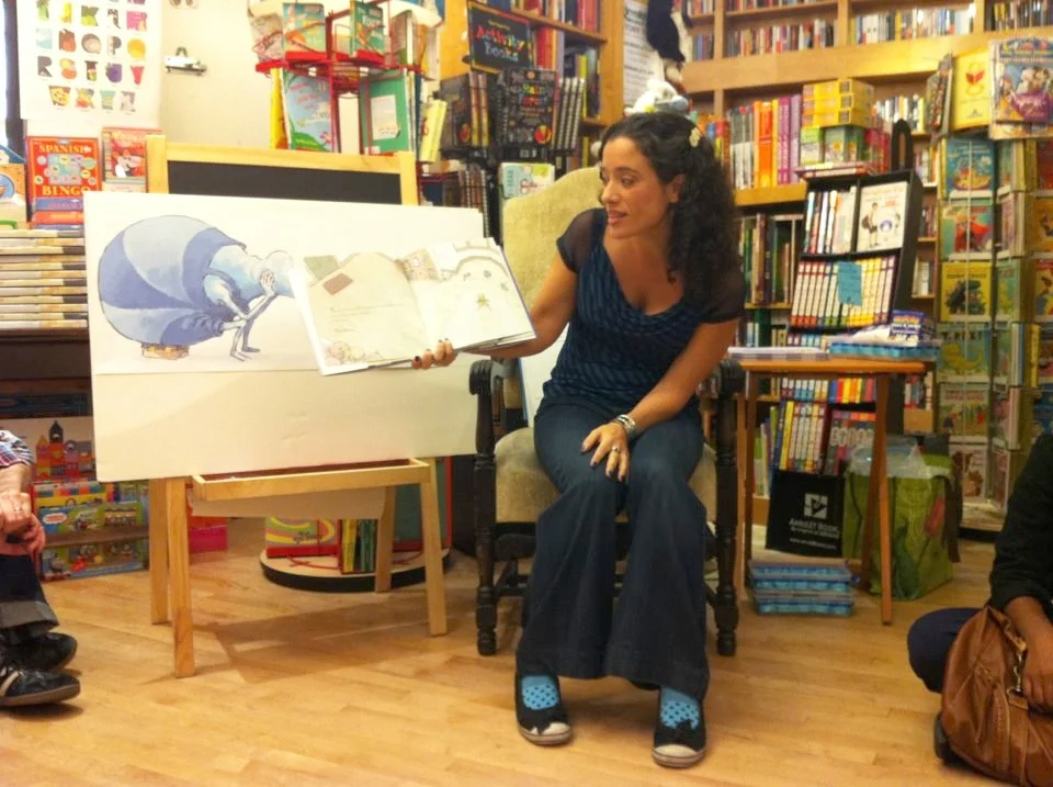 Levis reads her book, Stuck with the Blooz , aloud during one of her frequent classroom visits.