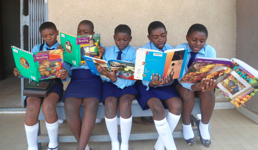 LitKids reading side by side in Cameroon.