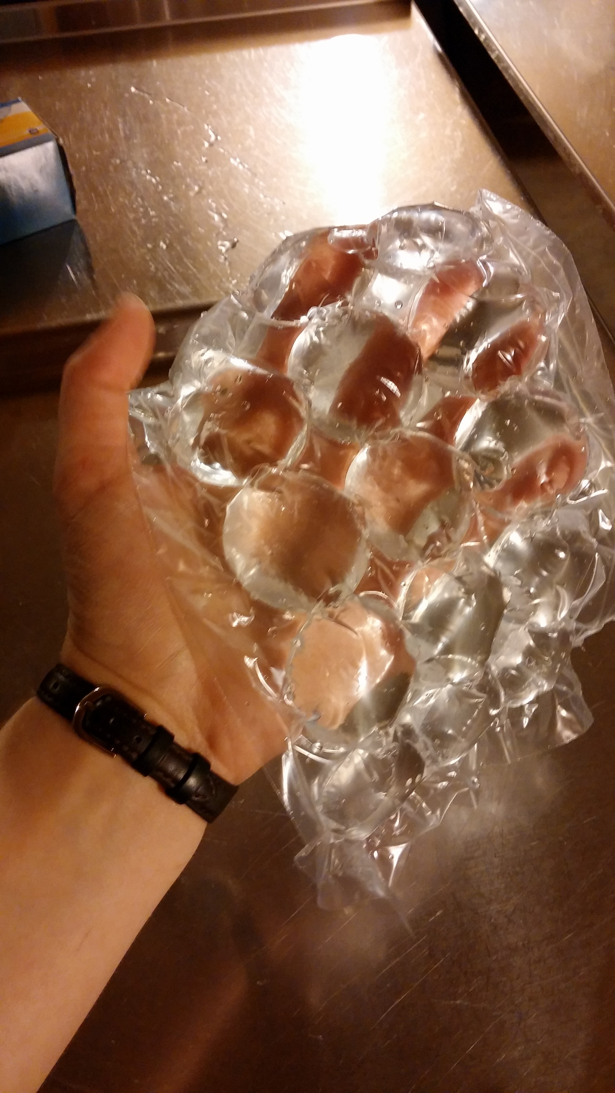 Great idea, right? It's like bubble wrap, except its bubbles of water that you put in your freezer, and when you pop them, ice cubes come out.
