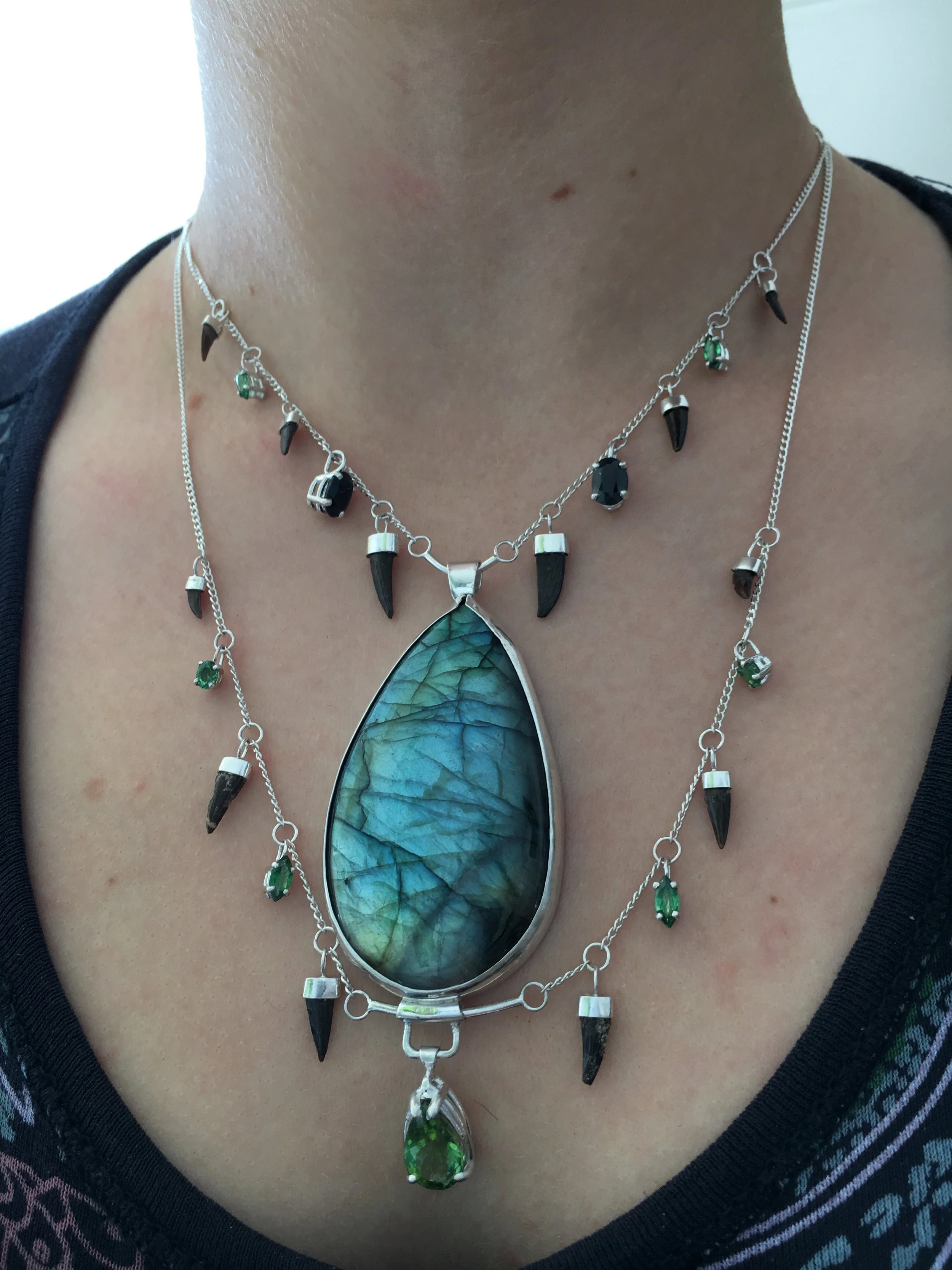 Fabricated custom necklace with stones, teeth, and sterling silver
