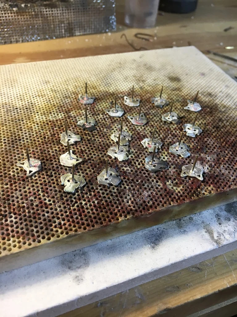 I solder all the earring posts to the back of the animals. Sorry I don't have an action shot of soldering. It's actually pretty exciting and it's my favorite part.