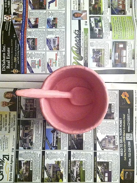 My aunt gave me a real estate catalog to lay down on the kitchen table while I added paint. Image taken Day 22