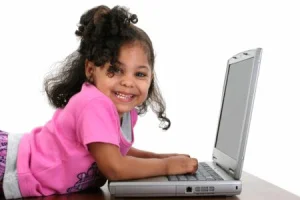 What do you think weighs more, the kid or the laptop?