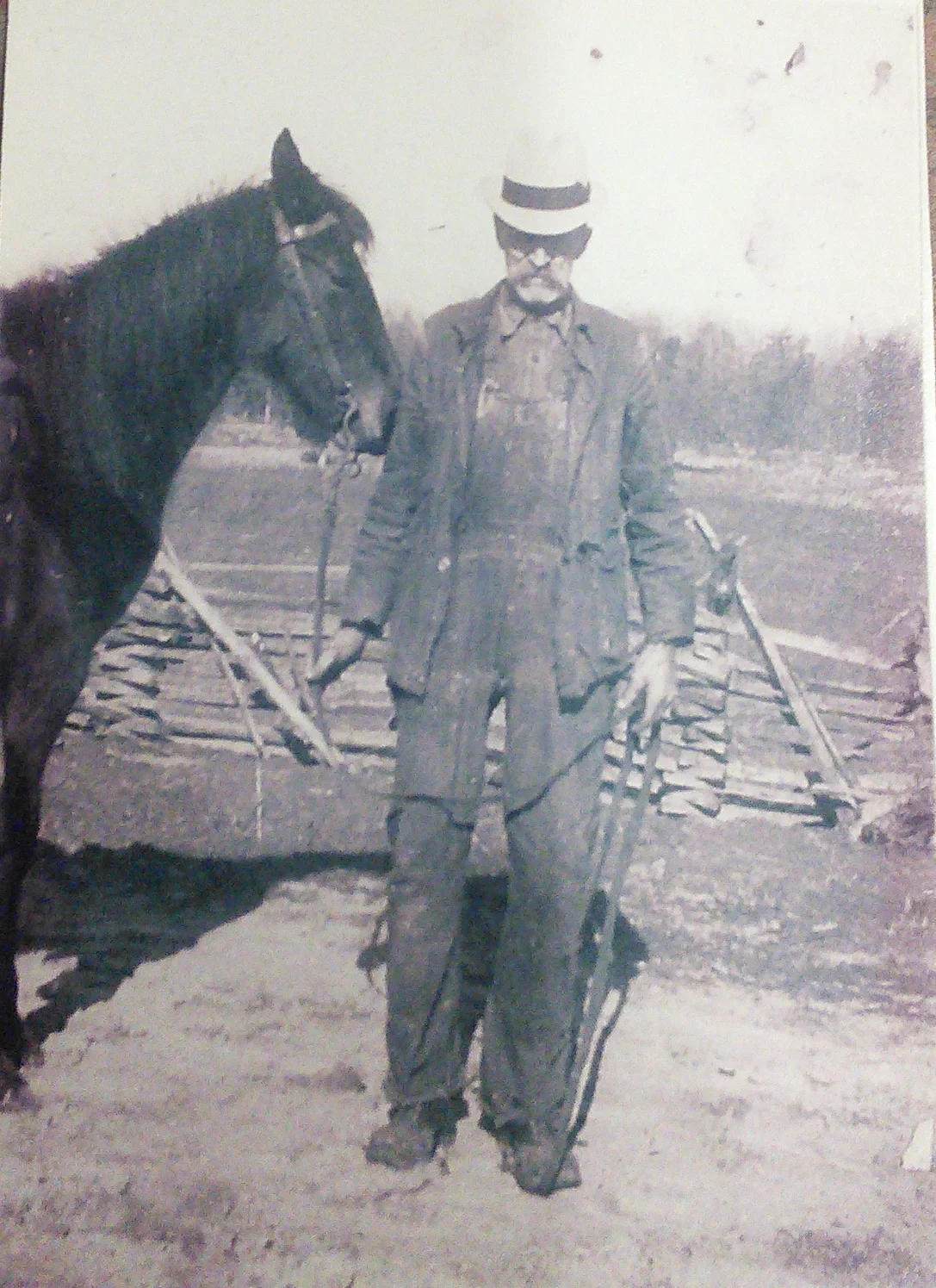 Tom Norris home from the fields wearing his familiar overalls