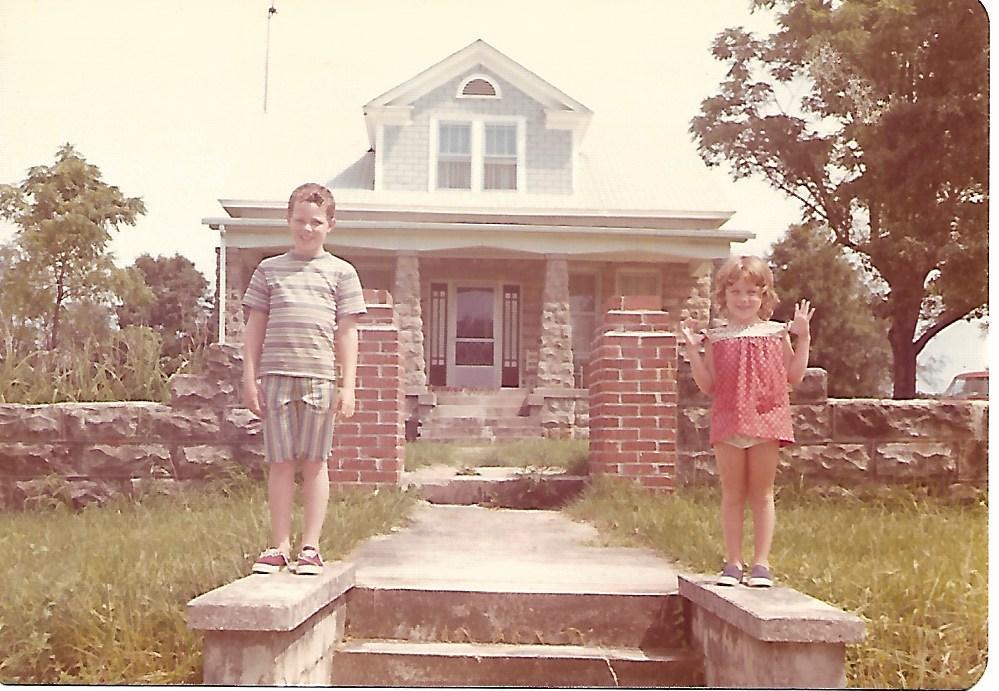Shawna with her brother in front of the Lockhart House, home of her great-grandmother.