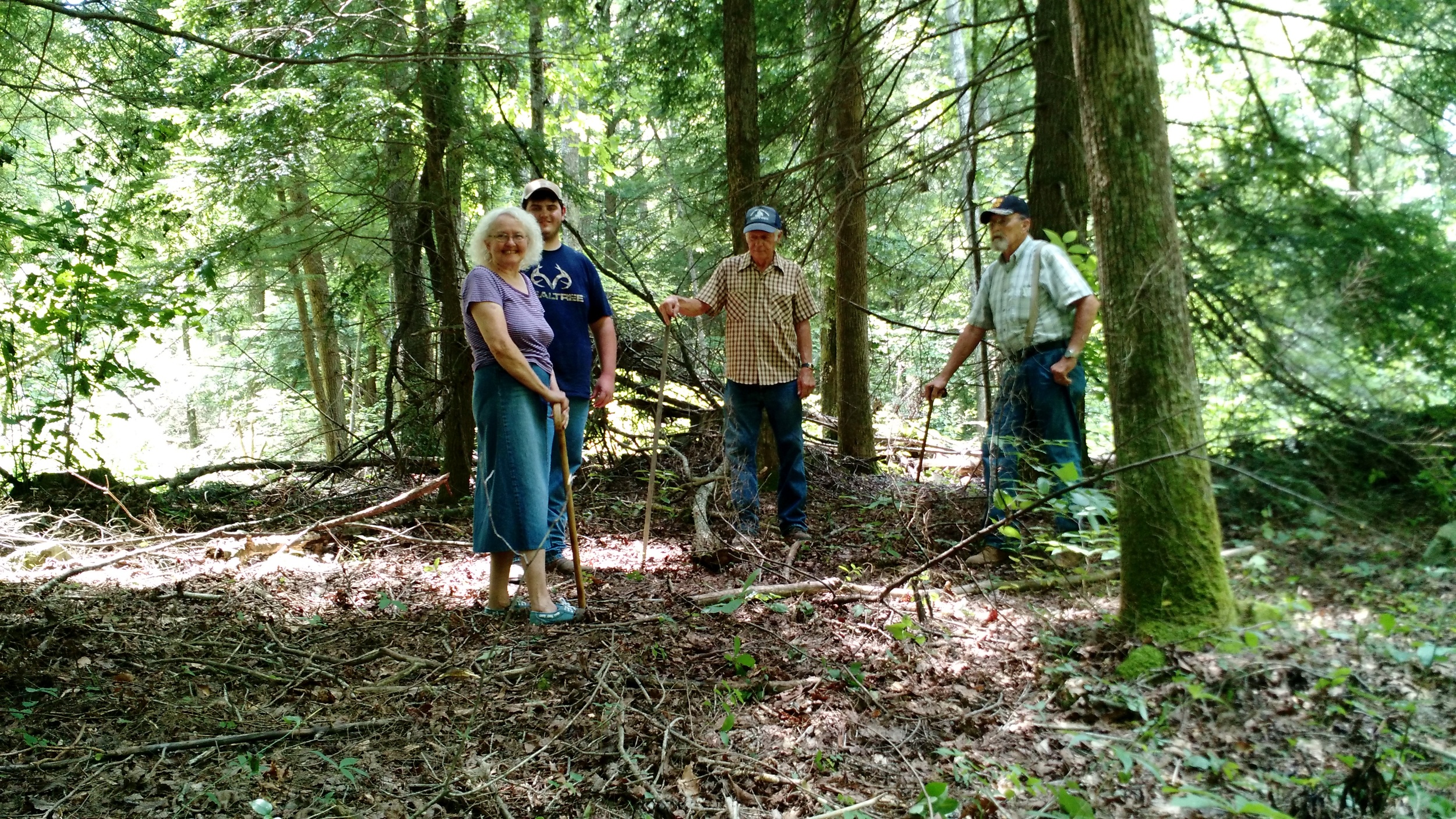 Freda Key Thompson (Great Granddaughter of Stephen Key), Logan Shaver, Darrell Stepp and Harlon Thompson stand in the clearing that remains where the house once stood.
