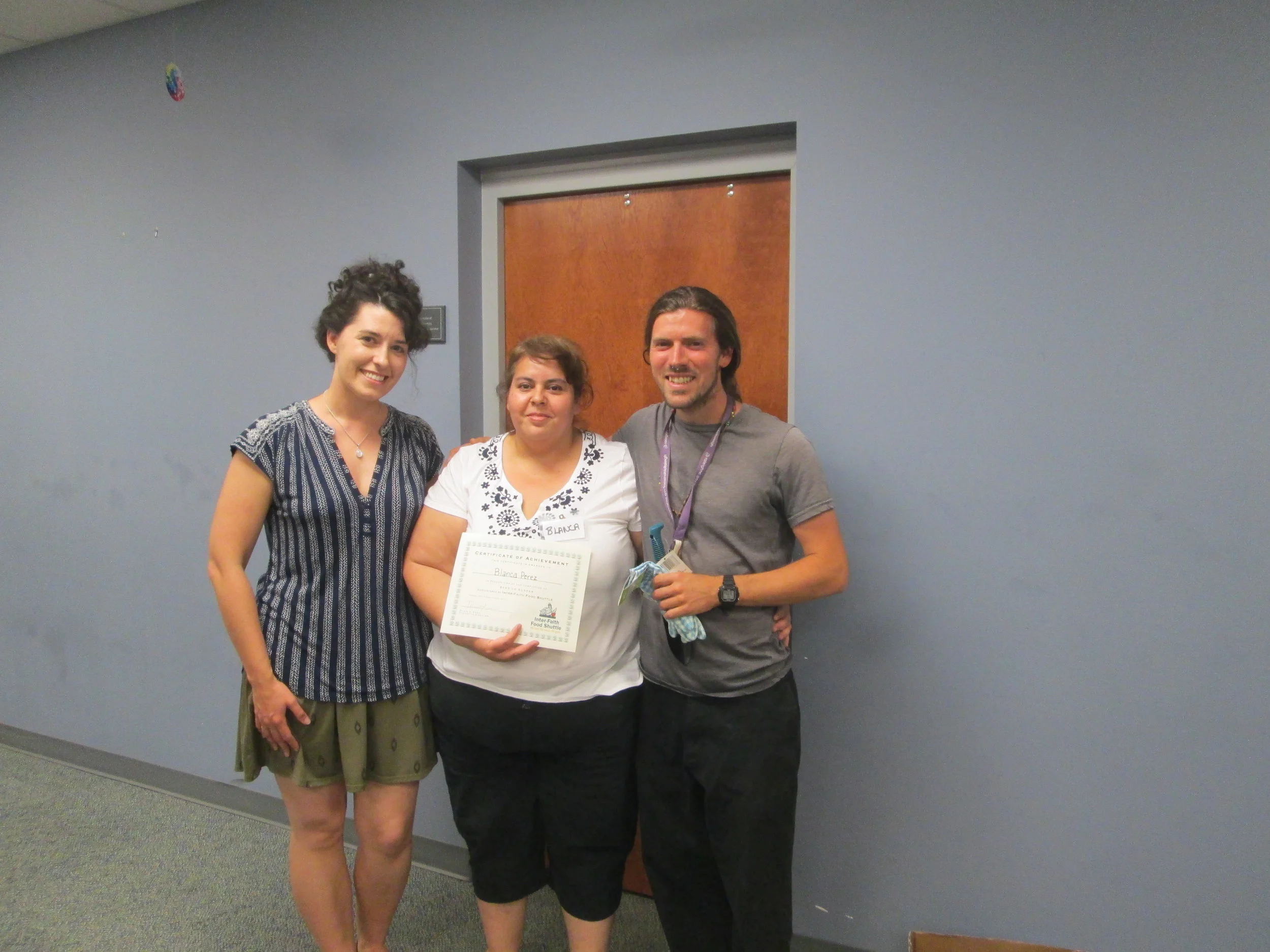 Blanca Perez (middle) with Inter-Faith Food Shuttle Katie Murray (L) and Alliance Community Garden & Wellness Coordinator Jesse Crouch (R) at Seed to Supper Graduation.