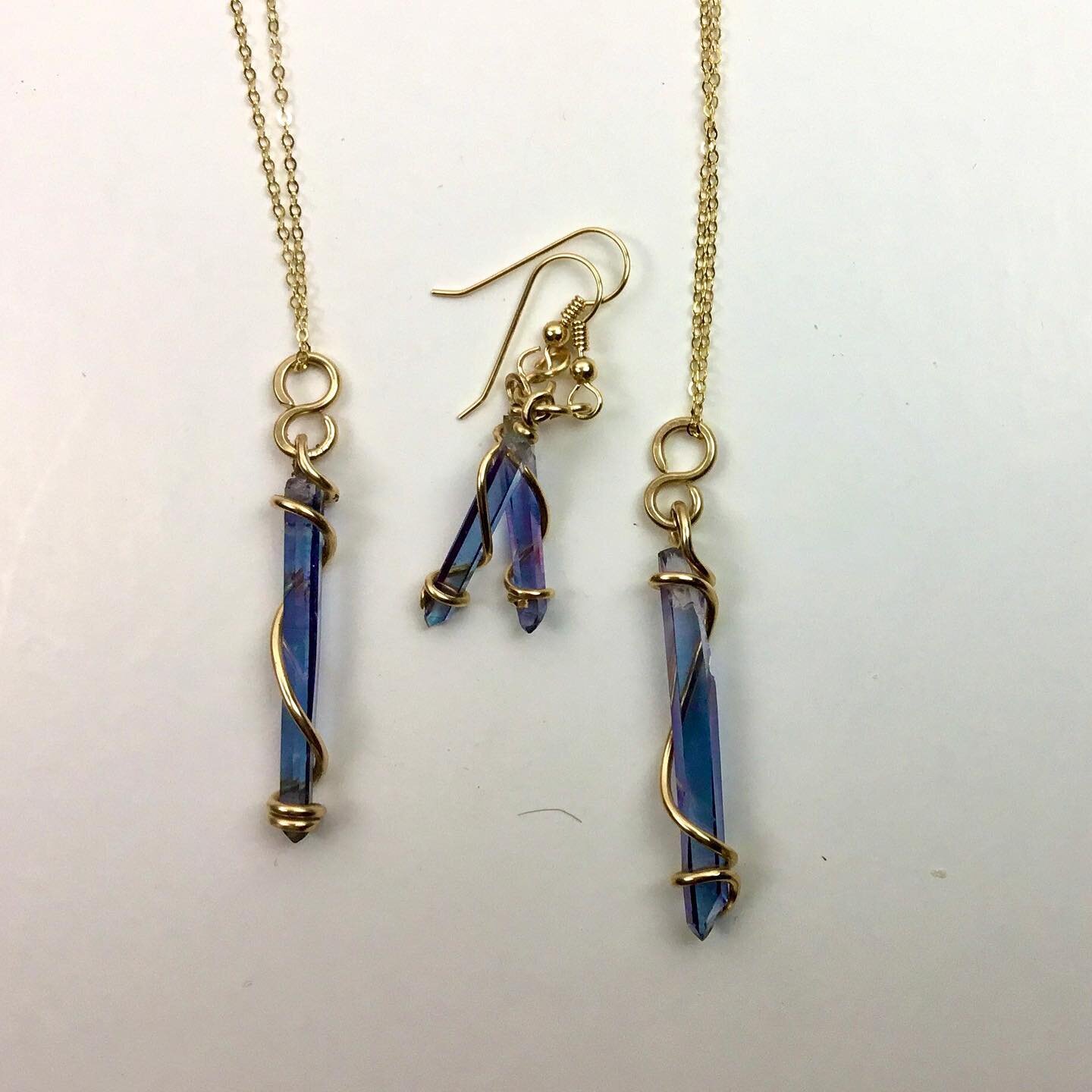 Aqua Aura in gold filled wire. This is translucent blue quartz, a fact for fully appreciated by my lens.