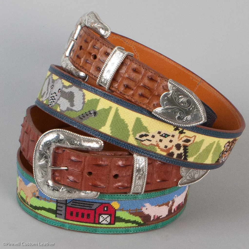 Needlepoint belt, fully framed, hornback alligator tabs, sterling silver engraved buckle