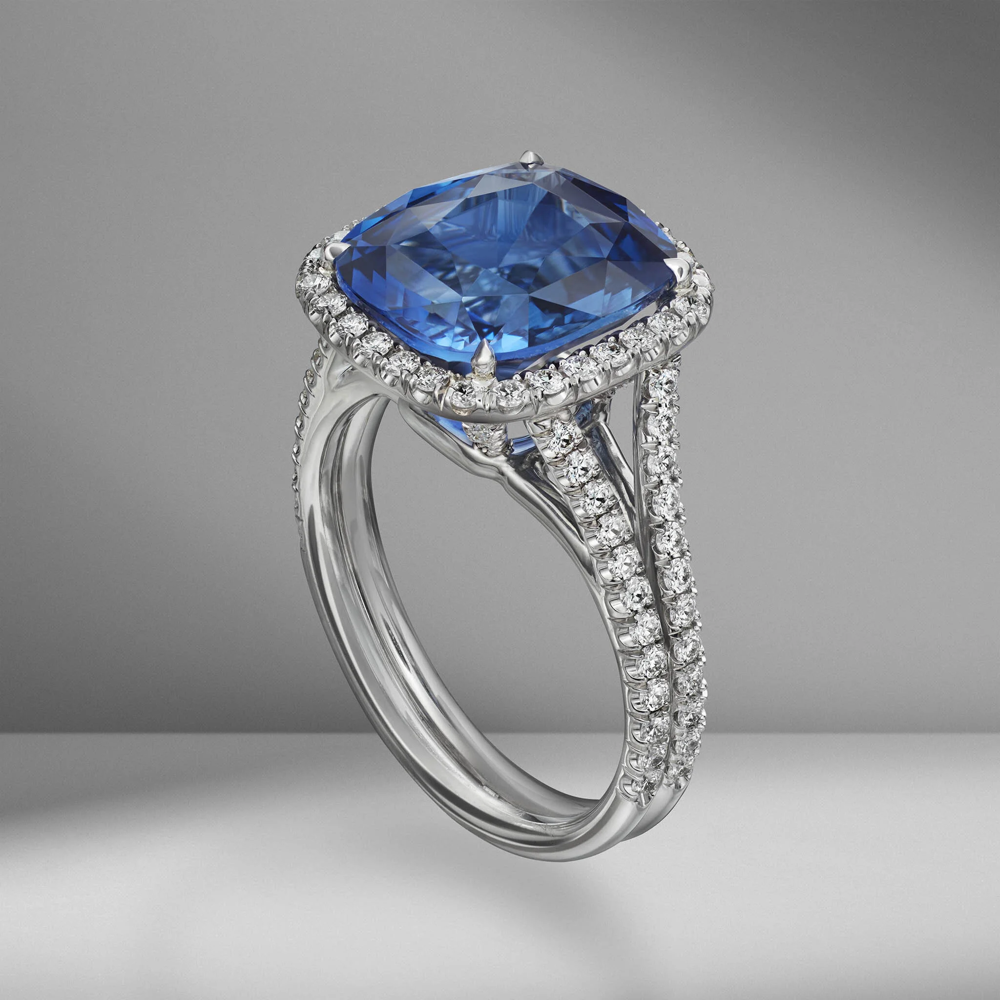 MG Ring Sapphire PT CU 6•03 halo pv splt Angle 2 early.jpg
