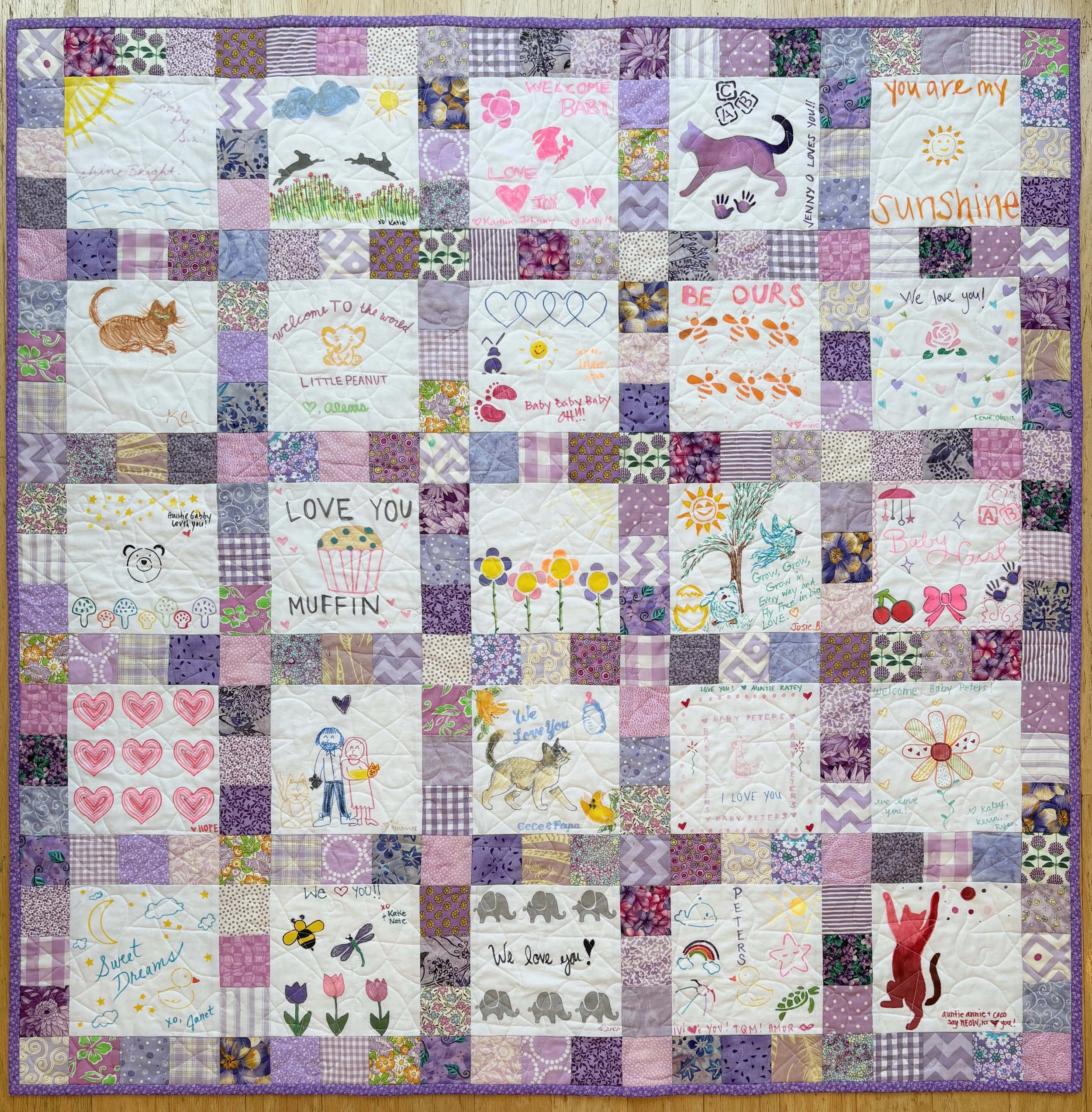 Quilt with "light purple" fabrics as surrounding squares