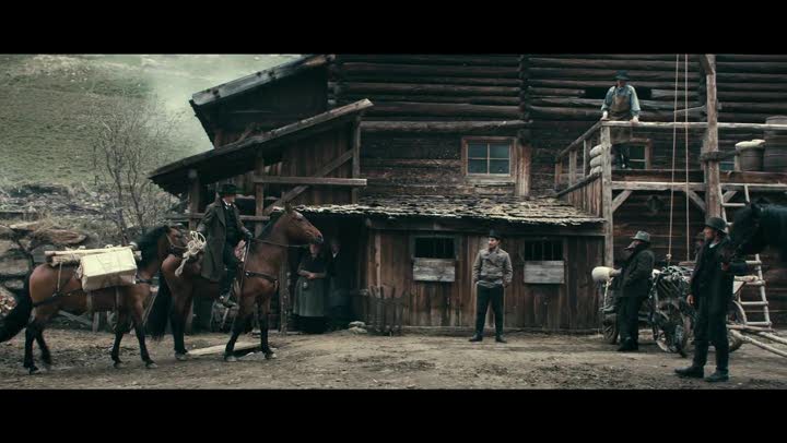 Scene from "The Dark Valley" Sam Riley's character riding into town complete with daguerreotype gear packed up on a second horse.