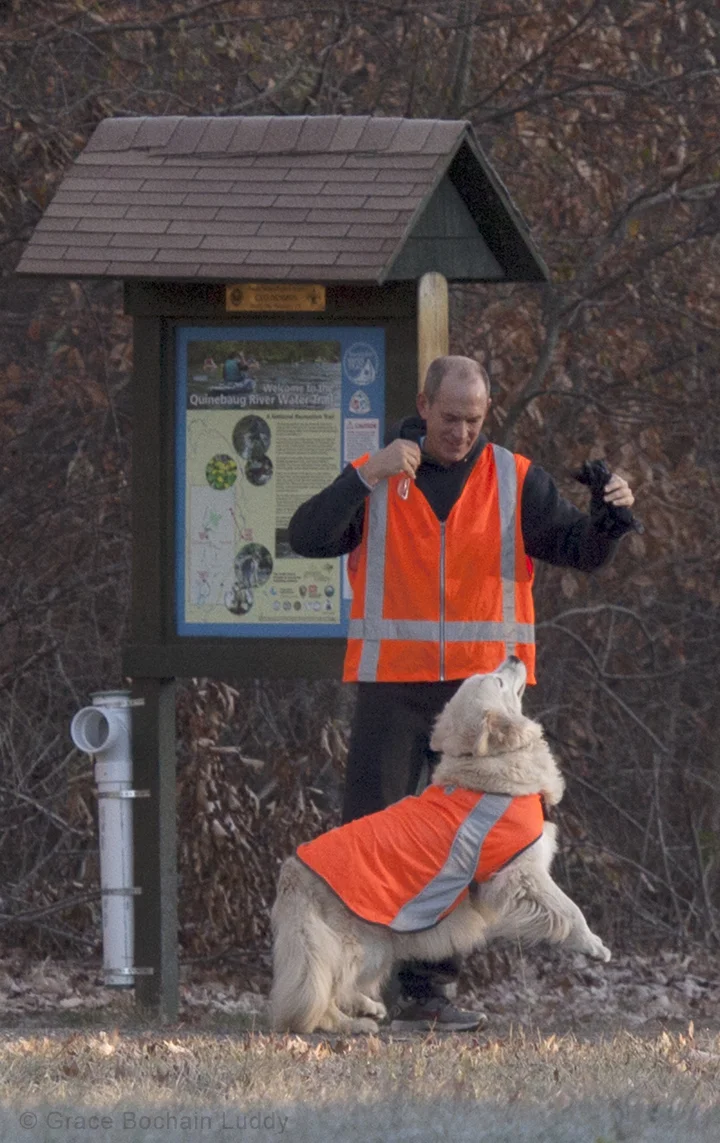 I feel compelled to tell you that George is a lot thinner in fact, than he looks in this picture. It's just that his arms are up and that's stretching out his hunting vest. That's Molly with him.