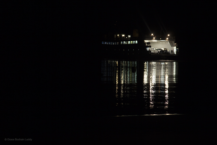 The Block Island Ferry, turned around and backing up to get to the dock on Block Island. See the deck hand, waiting in back, and the line of light defining the shoreline?
