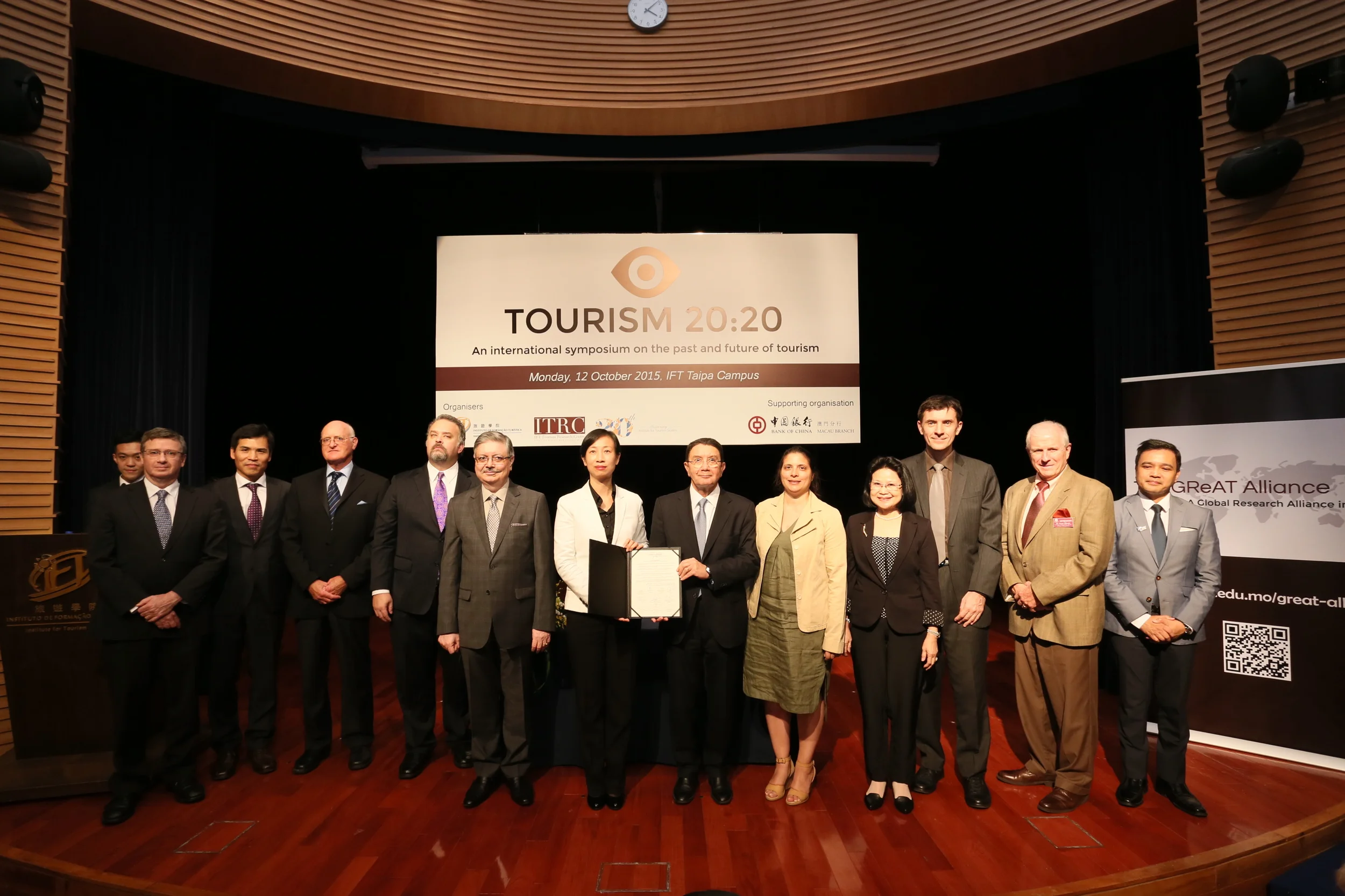 The Honorable Dr. Taleb Rifai, Secretary General of UNWTO and Dr. Fanny Vong, President of IFT, hold up the Joint Statement of the GReAT Alliance after the signing ceremony. Held during the Tourism 20:20 International Symposium on the Past and Future of Tourism at IFT's Taipa Campus, Monday, 12 October 2015.