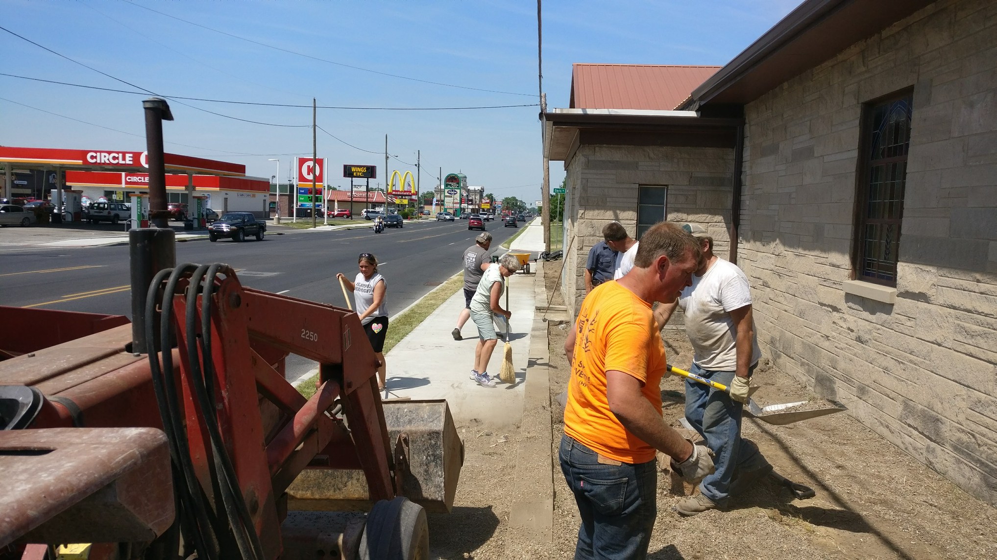 Working hard around the Fellowship Hall along National Avenue in Brazil, Indiana.