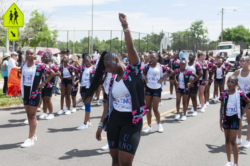  The Platinum Divas dance leader raises a fist in honor of Black Power during the annual Juneteenth parade. 