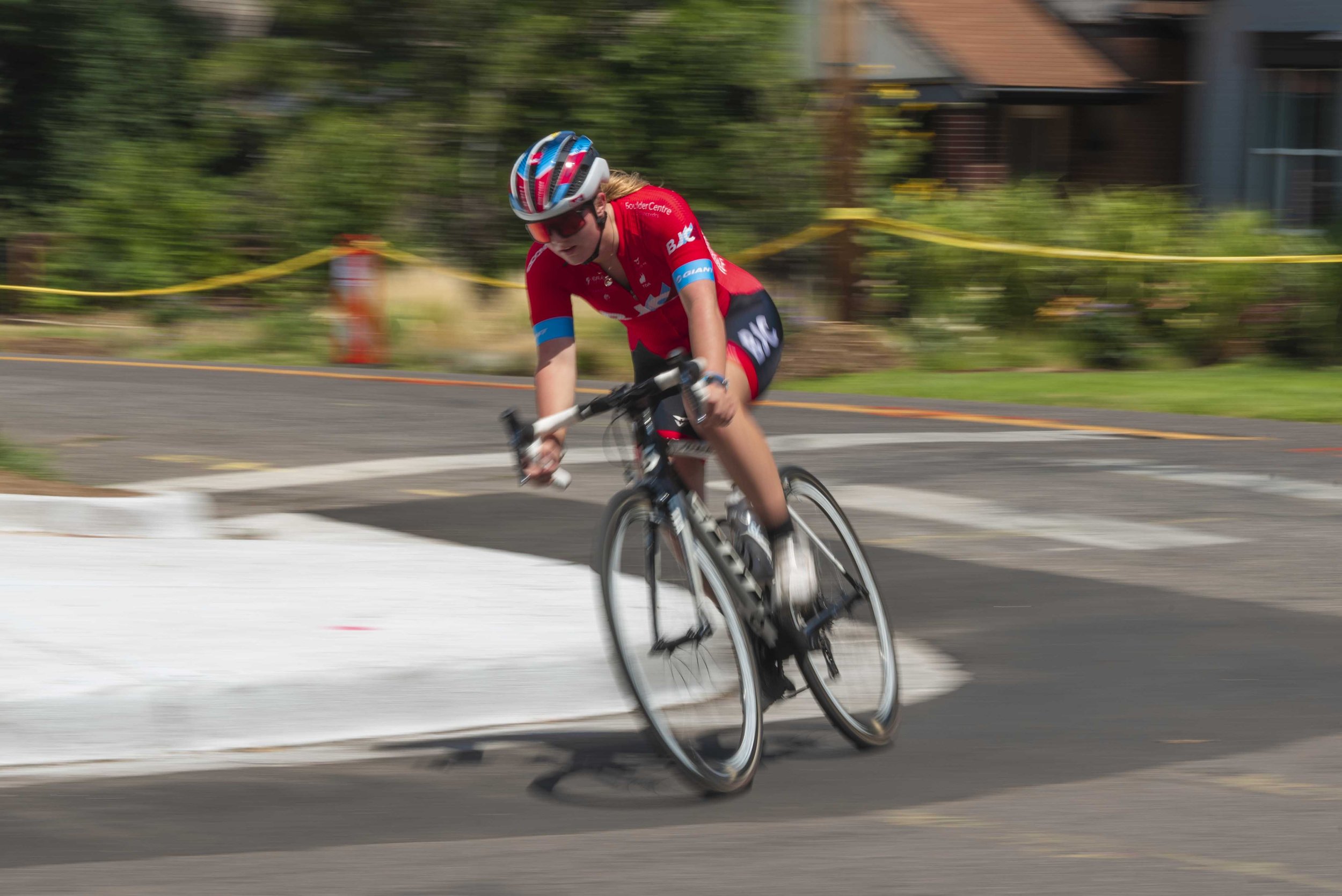  Haydn Hludzinski speeds around the corner in the Mike Nields Memorial Denver City Criterium race. 