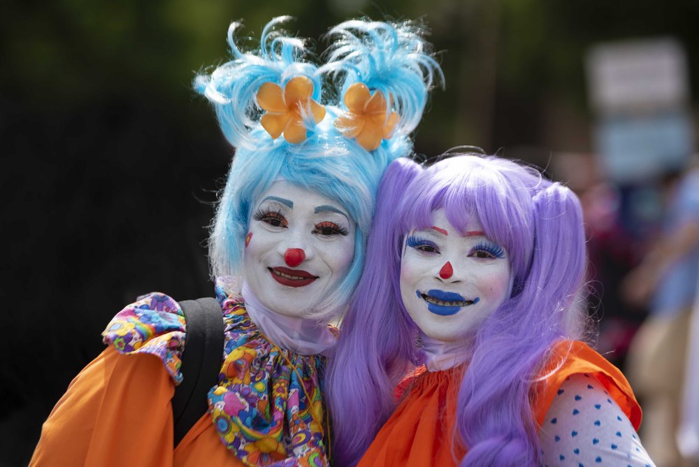  Michele Gaddis (left), performs as BlahAwesome and Misheika Gaddis (right) performs as   Rhythm   pose for a portrait before the start of Juneteenth parade.  