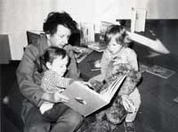Volunteer Elizabeth Farr reading with Christine Klinepeter and Becky Moody