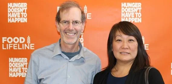 PIMG’s Scott Schaffer with Shirley Bekins of Providence Health & Services at Food Lifeline’s grand opening event in Seattle. The new facility appears below.