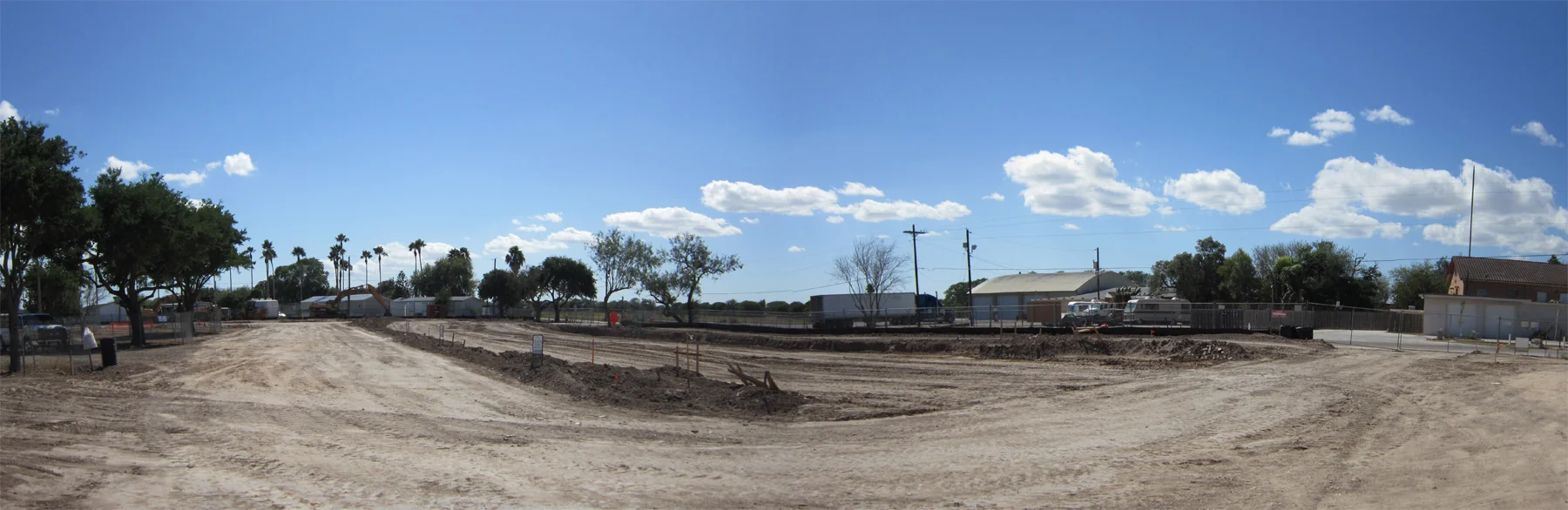 Standing at the northwest street corner facing the building pad of the first 10 houses.