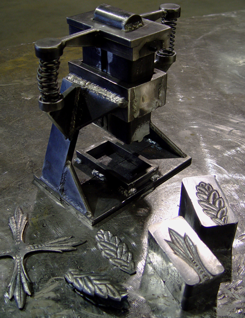 Custom tooling and hand carved dies for forging decorative metal leaves, by Jeremyah.