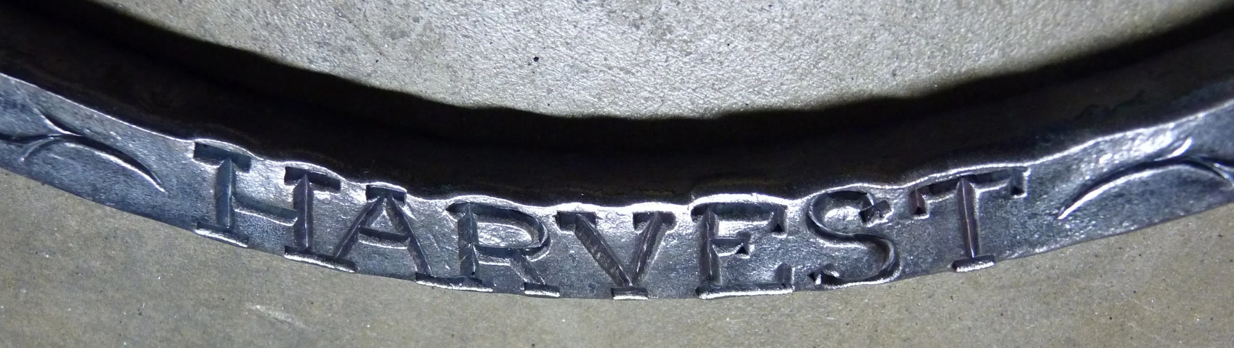  forged metal frame for a cast bronze medallion 